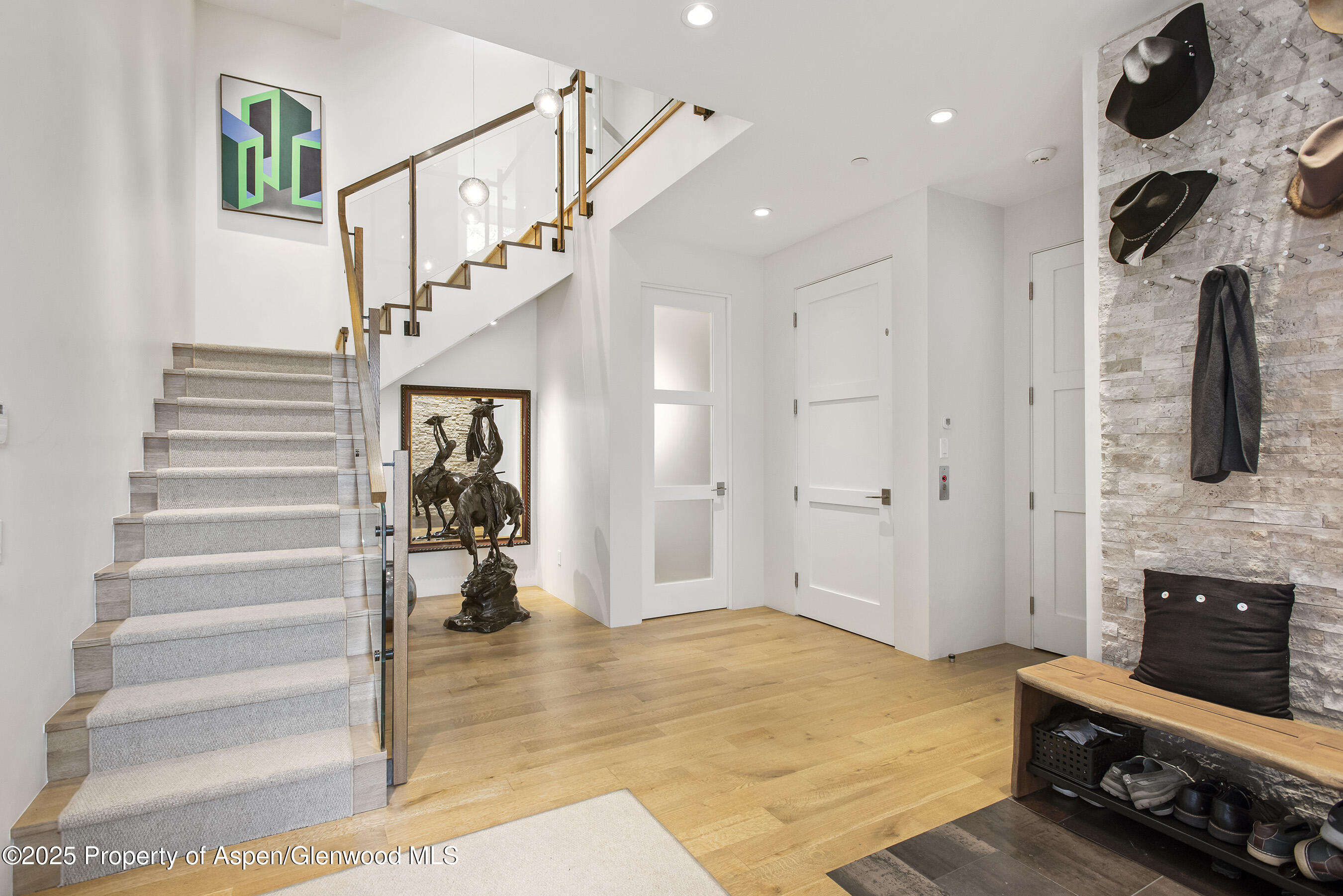751 Promontory Lane Basalt, CO 81621 - Photo 27 of 41 a view of an entryway with wooden floor and a living room