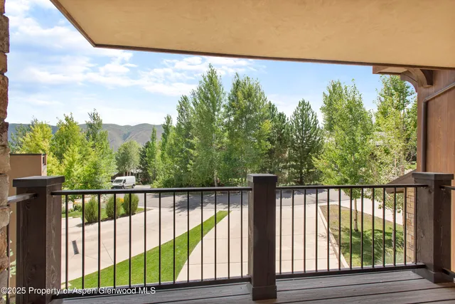 a view of balcony with wooden floor