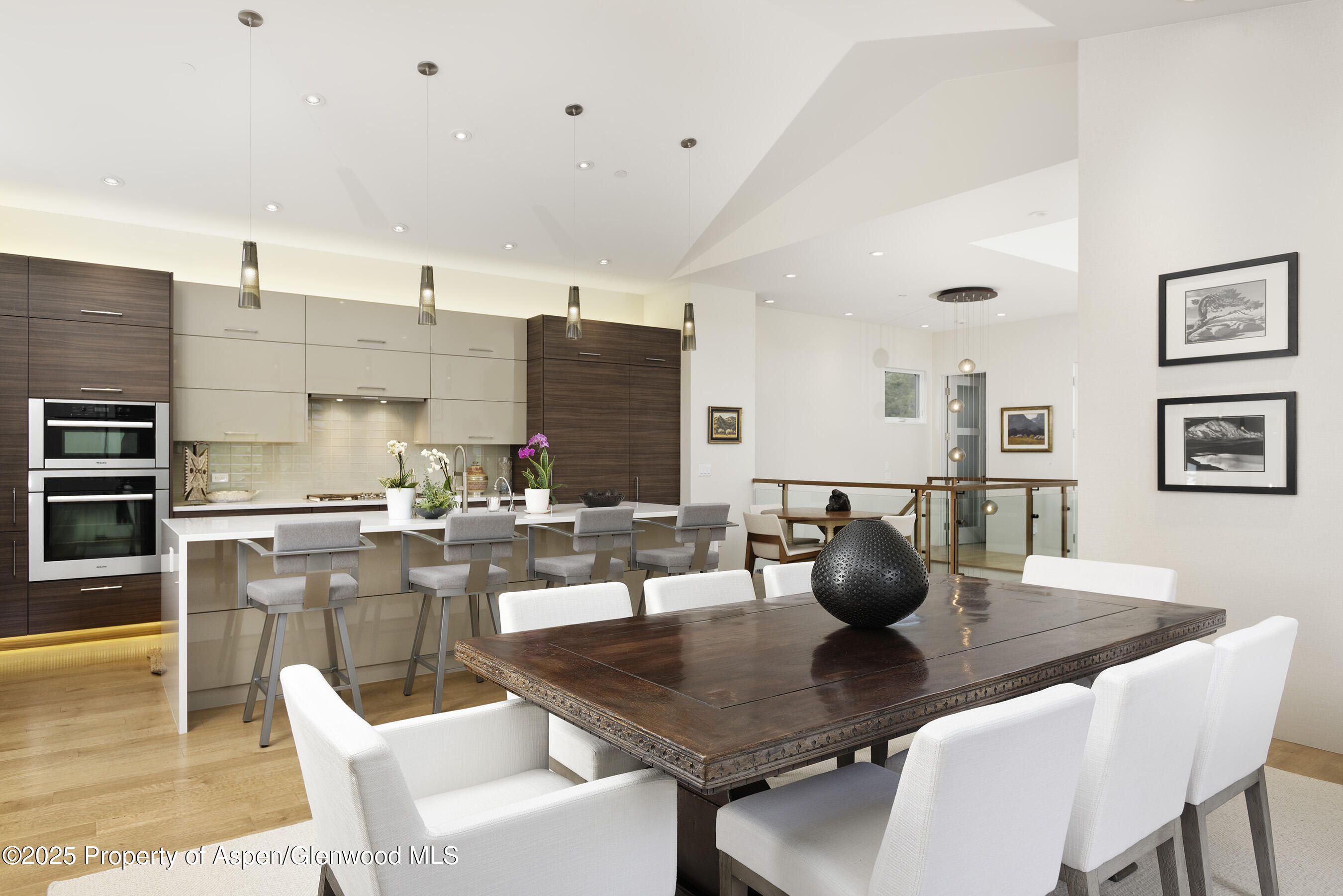 751 Promontory Lane Basalt, CO 81621 - Photo 6 of 41 a kitchen with a dining table chairs and stainless steel appliances