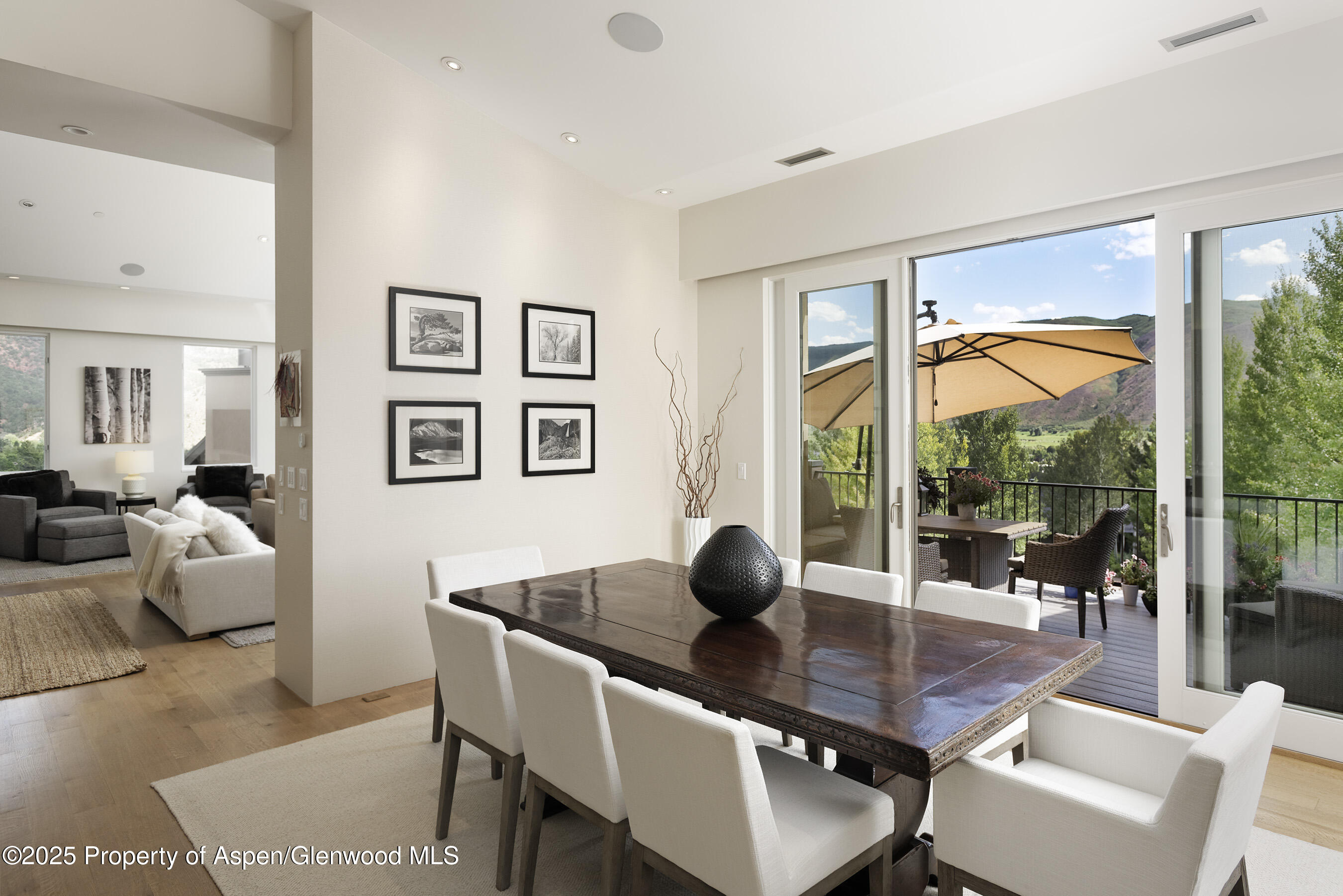 751 Promontory Lane Basalt, CO 81621 - Photo 7 of 41 a dining room with wooden floor and glass door