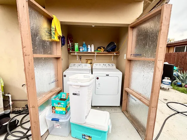 a utility room with dryer and washer