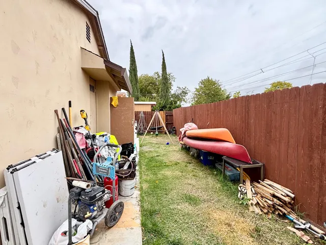 a view of a chairs and table in patio
