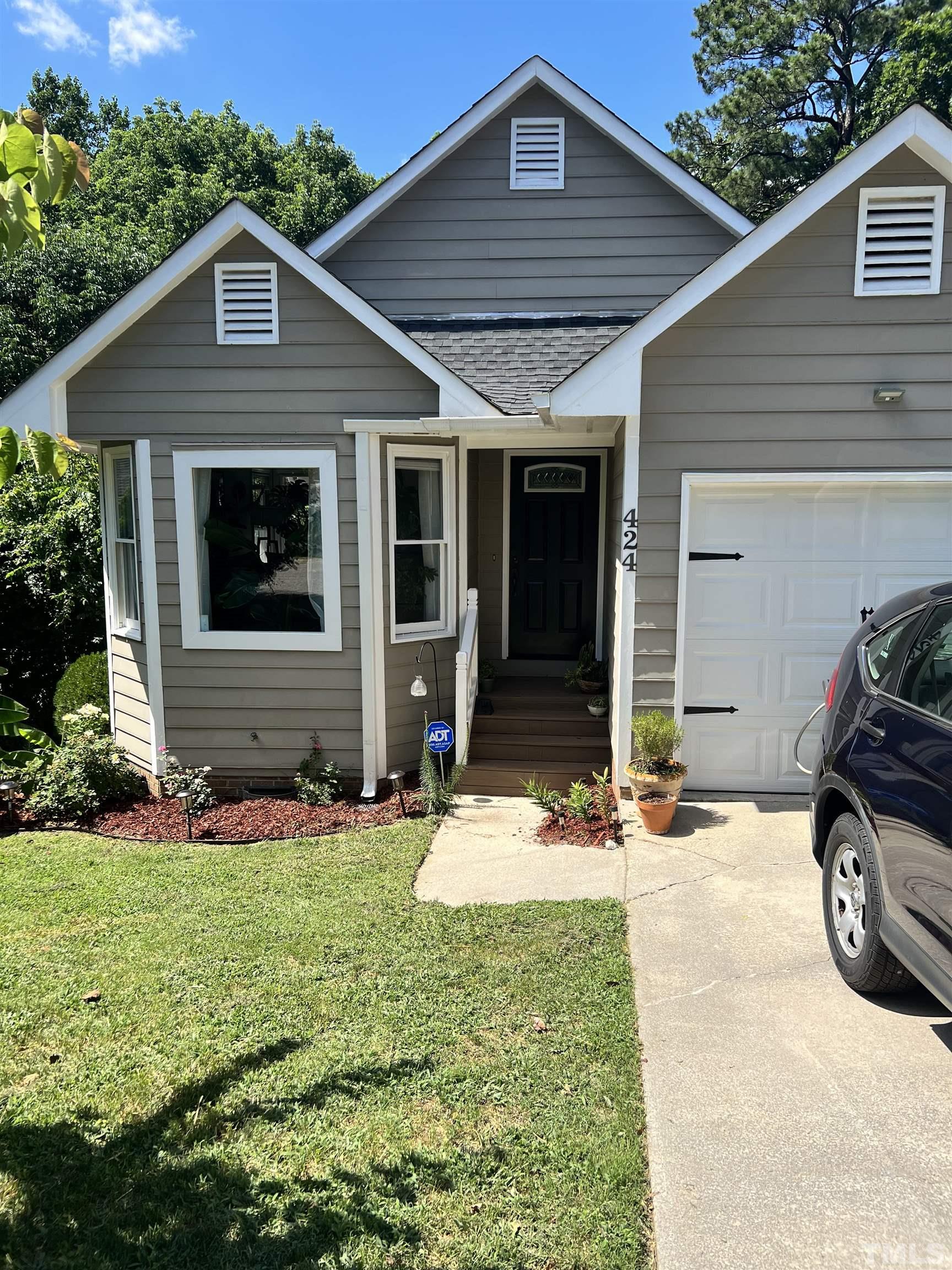 424 Dickens Drive Raleigh, NC 27610 - Photo 1 of 33 a car parked in front of a house