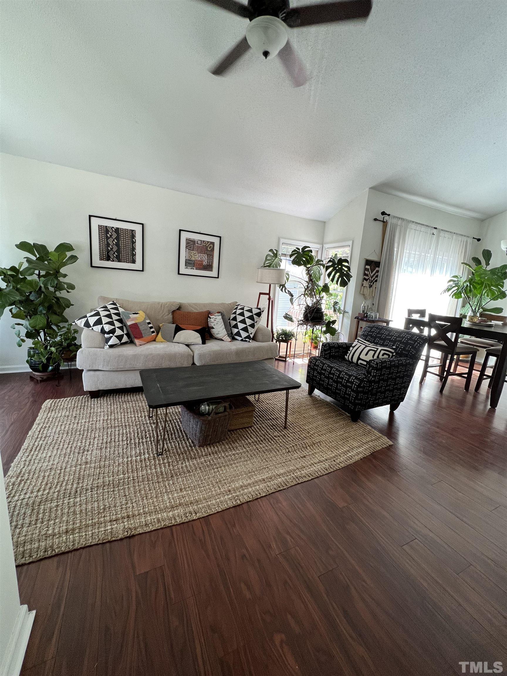 424 Dickens Drive Raleigh, NC 27610 - Photo 2 of 33 a living room with furniture and a wooden floor