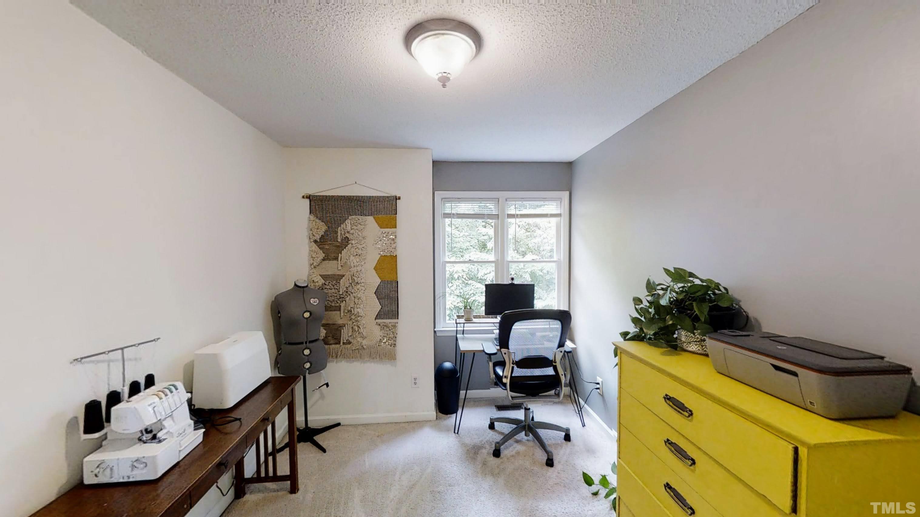 424 Dickens Drive Raleigh, NC 27610 - Photo 21 of 33 a bed room with a bed and a chair