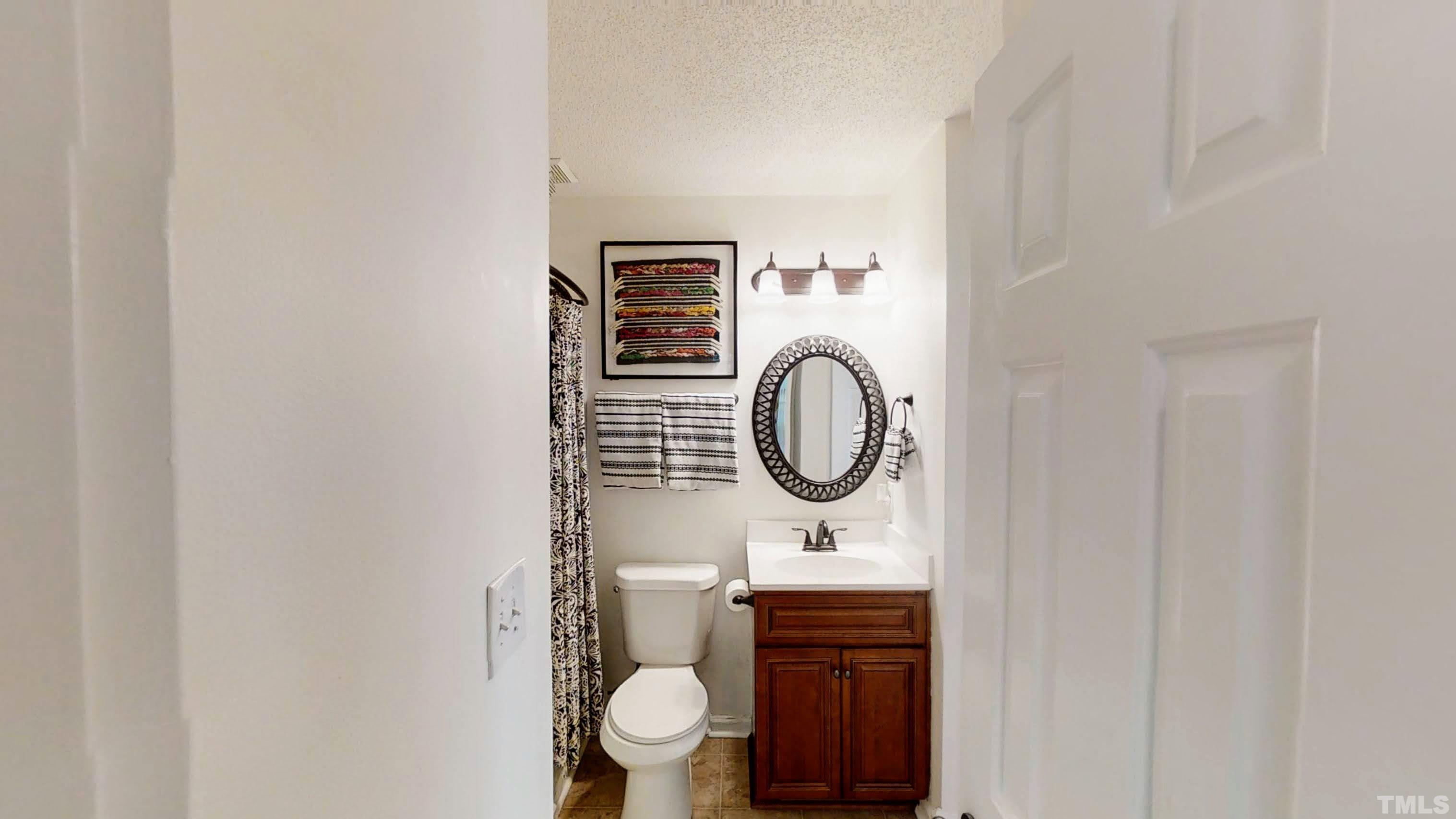 424 Dickens Drive Raleigh, NC 27610 - Photo 23 of 33 a bathroom with a toilet and a sink