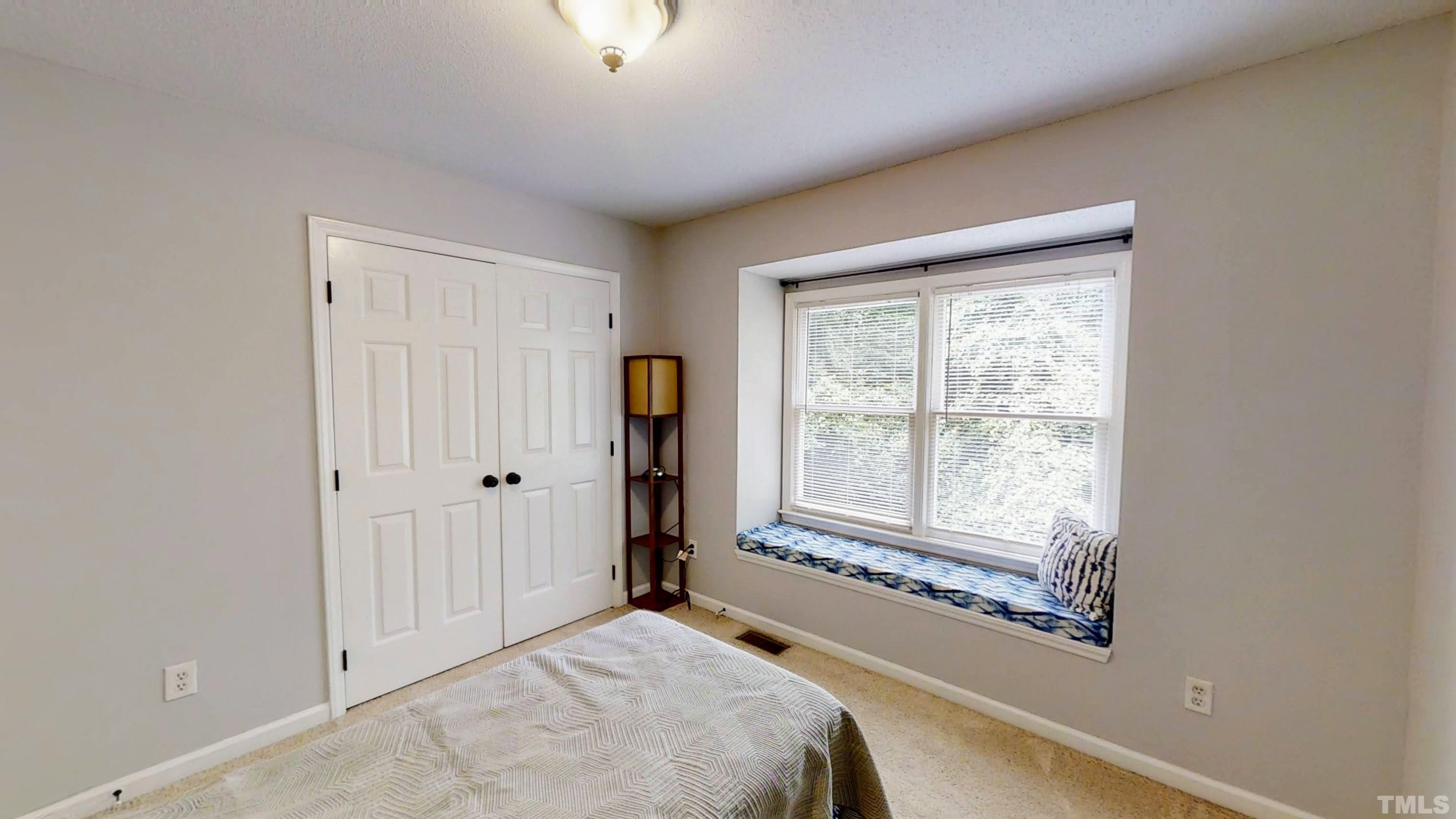 424 Dickens Drive Raleigh, NC 27610 - Photo 28 of 33 a bedroom with a bed and a window