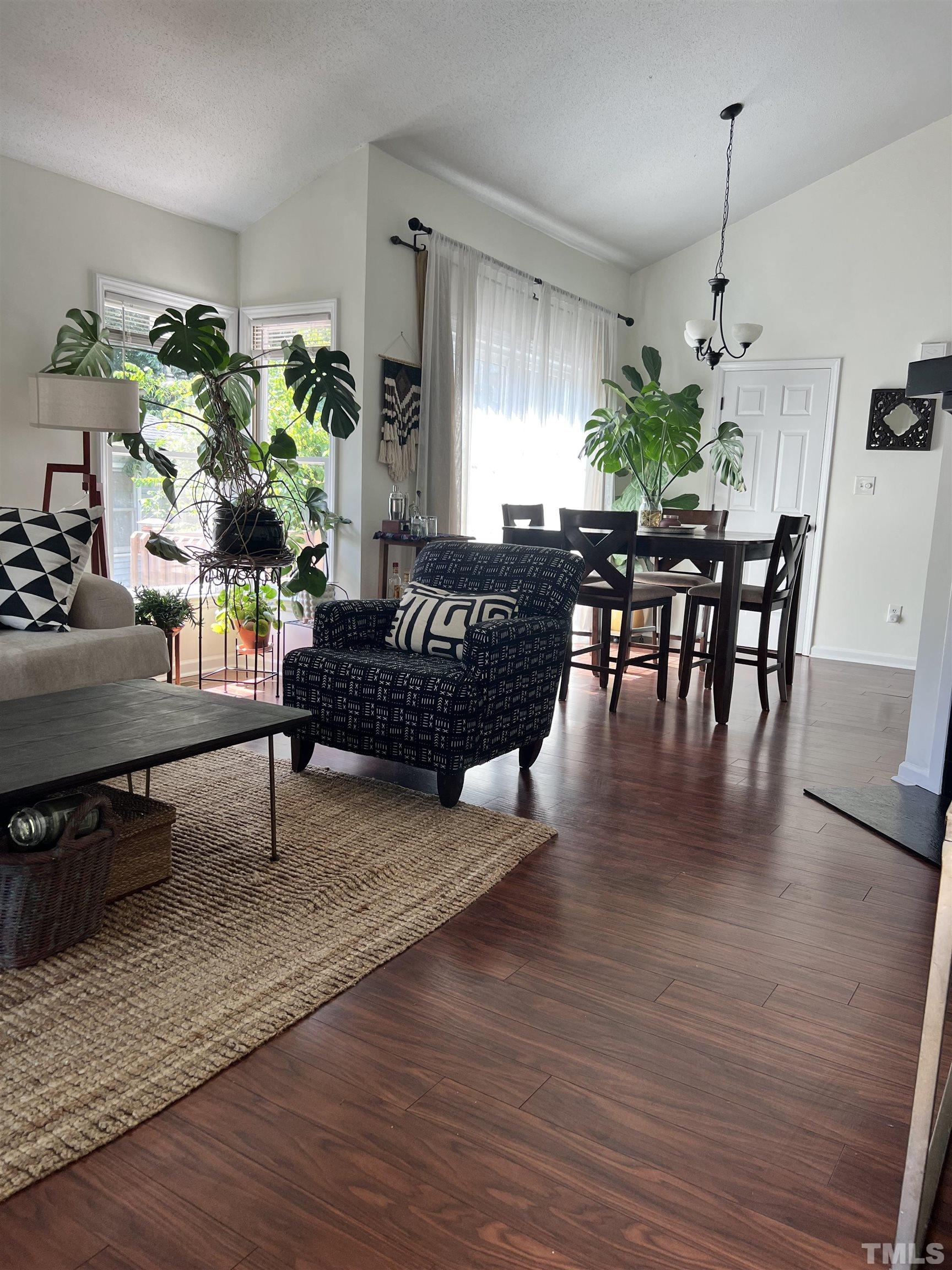 424 Dickens Drive Raleigh, NC 27610 - Photo 3 of 33 a living room with furniture and a wooden floor