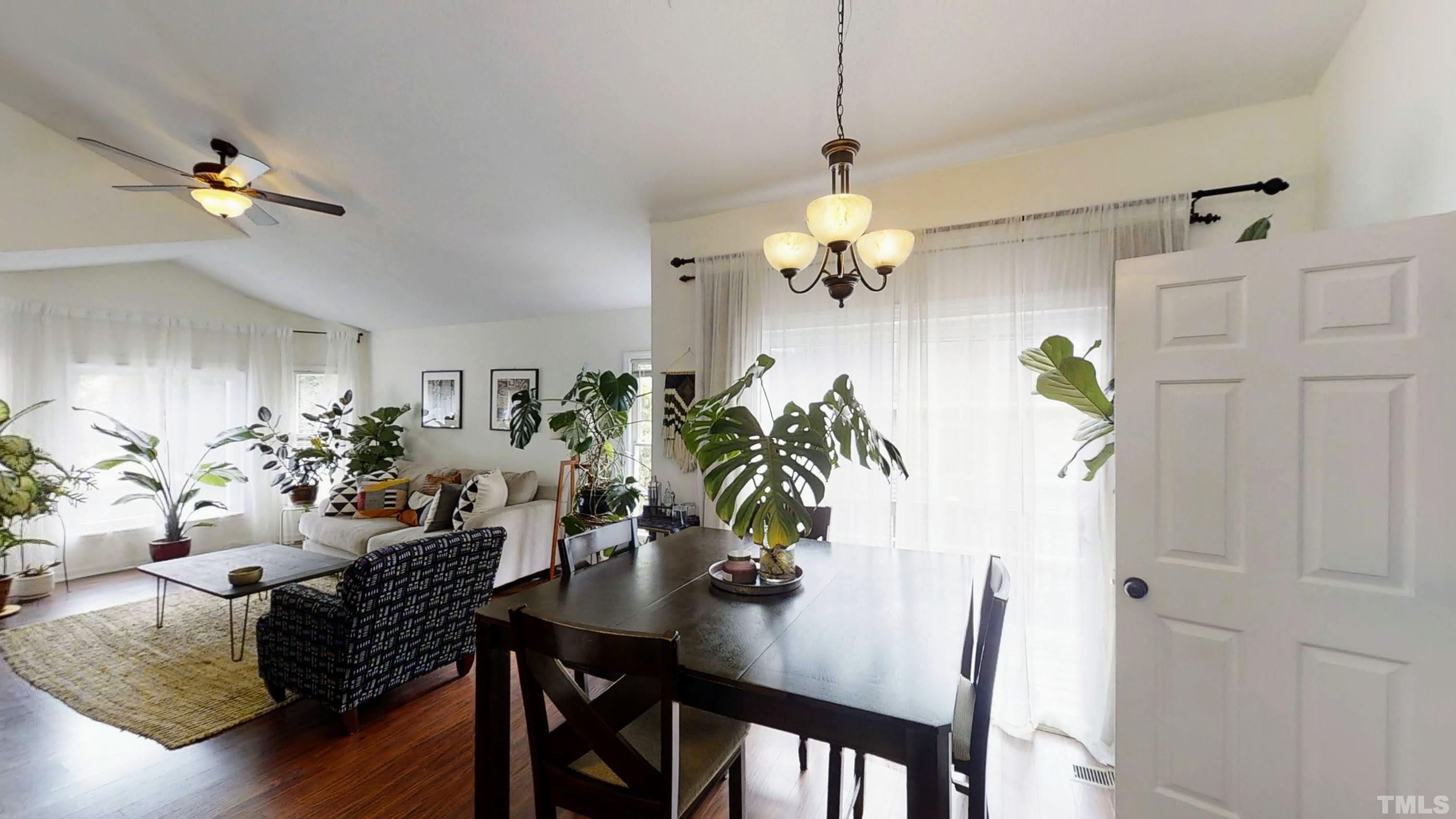 424 Dickens Drive Raleigh, NC 27610 - Photo 10 of 33 a view of a dining room with furniture and chandelier