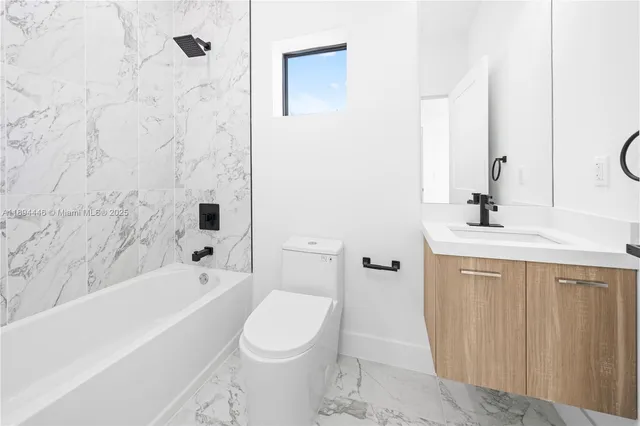 a view of a bathroom with a sink and a tub