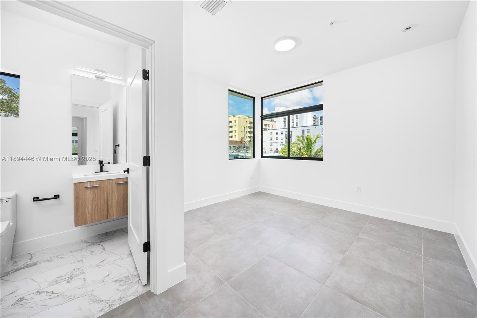526 Southwest 2nd Street, Unit 1 Miami, FL 33130 - Photo 24 of 36 a view of a bathroom with a sink and a tub