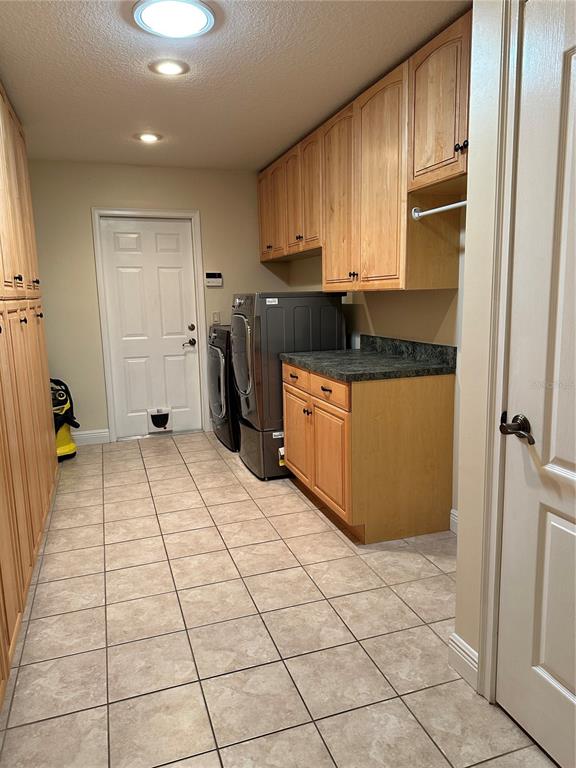 8209 Southwest 196th Ct Road Dunnellon, FL 34432 - Photo 12 of 29 a kitchen with stainless steel appliances granite countertop a refrigerator and a stove