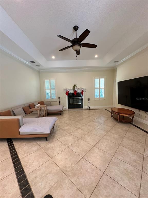 8209 Southwest 196th Ct Road Dunnellon, FL 34432 - Photo 13 of 29 a living room with furniture and a flat screen tv