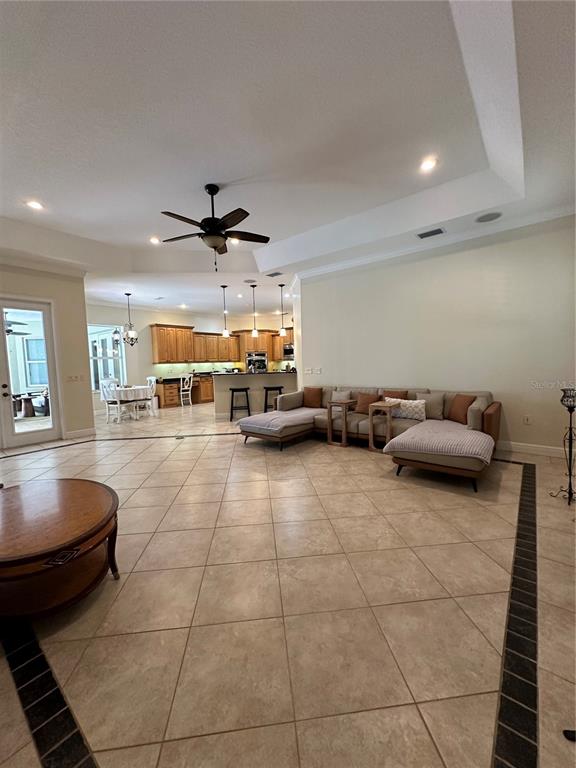 8209 Southwest 196th Ct Road Dunnellon, FL 34432 - Photo 14 of 29 a living room with furniture and a ceiling fan