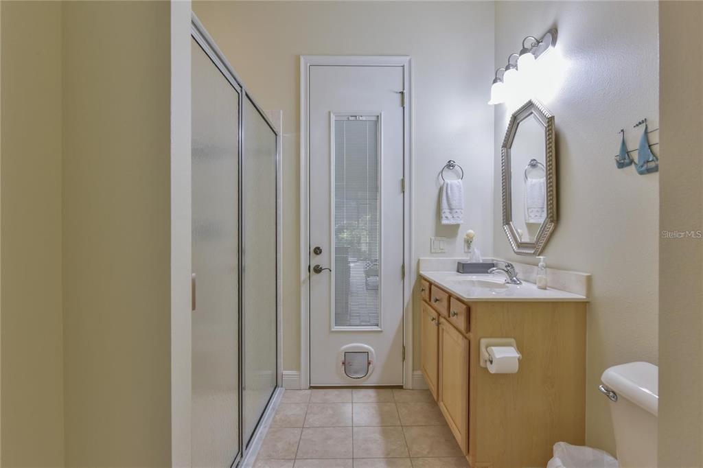 8209 Southwest 196th Ct Road Dunnellon, FL 34432 - Photo 15 of 29 a spacious bathroom with a mirror a sink and a mirror