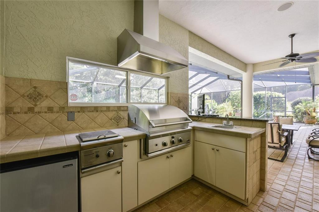 8209 Southwest 196th Ct Road Dunnellon, FL 34432 - Photo 24 of 29 a kitchen that has a sink and a stove