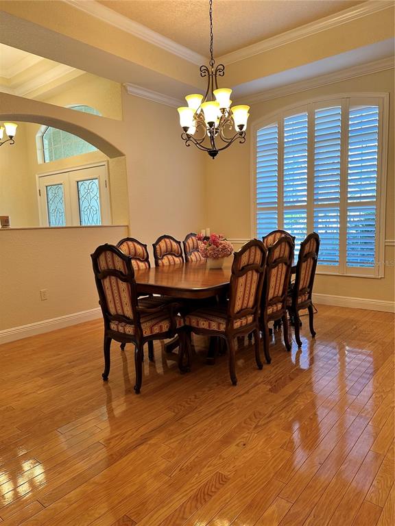 8209 Southwest 196th Ct Road Dunnellon, FL 34432 - Photo 6 of 29 a view of a dining room with furniture window and wooden floor