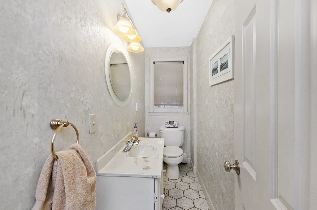 17 Nardone Road Needham, MA 02492 - Photo 11 of 22 a bathroom with a sink a toilet and a mirror