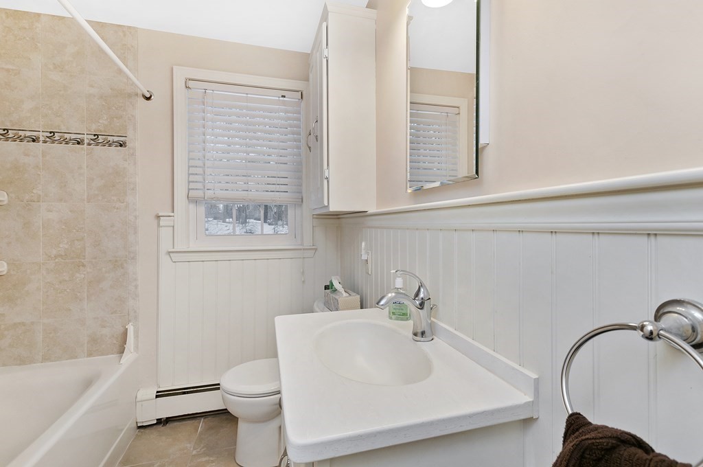 17 Nardone Road Needham, MA 02492 - Photo 12 of 22 a bathroom with a sink a toilet and a bathtub