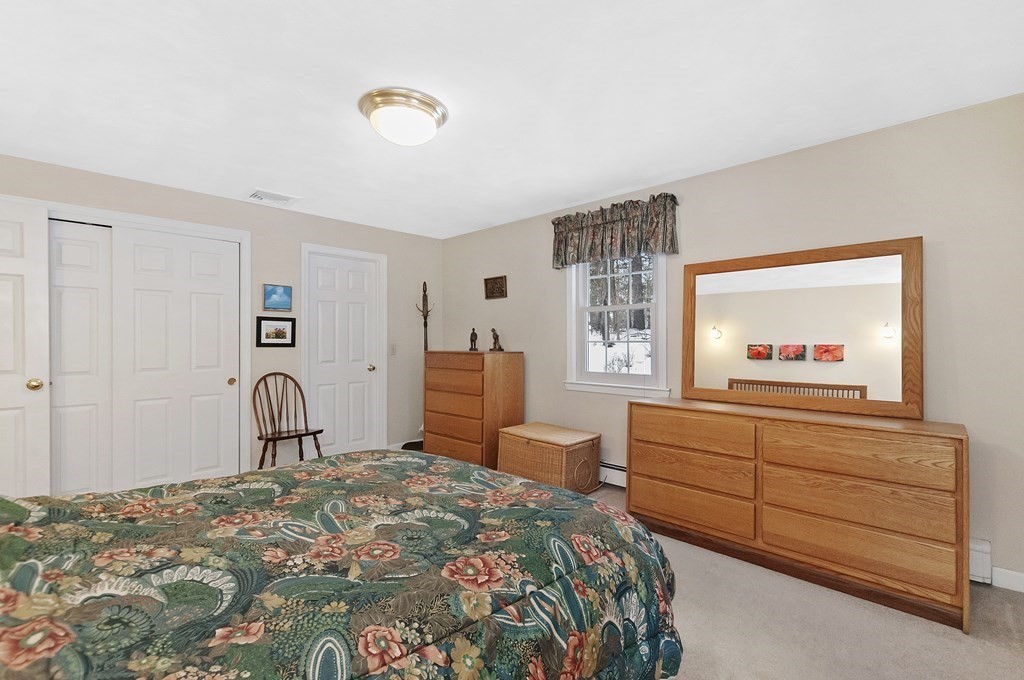 17 Nardone Road Needham, MA 02492 - Photo 17 of 22 a bedroom with a bed and a dresser