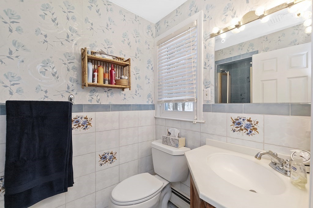 17 Nardone Road Needham, MA 02492 - Photo 19 of 22 a bathroom with a toilet sink and mirror