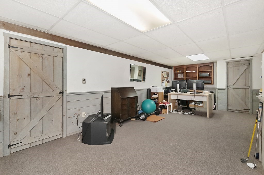 17 Nardone Road Needham, MA 02492 - Photo 20 of 22 a room with lots of furniture and a chandelier