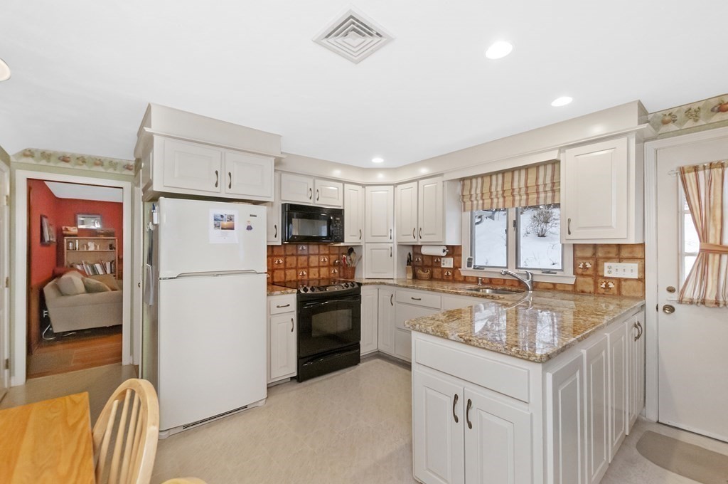 17 Nardone Road Needham, MA 02492 - Photo 4 of 22 a kitchen with refrigerator a stove a sink and a refrigerator