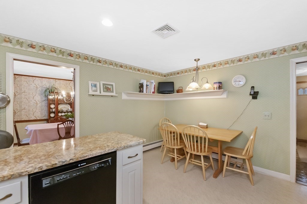 17 Nardone Road Needham, MA 02492 - Photo 5 of 22 a dining hall with stainless steel appliances granite countertop a dining table and chairs with wooden floor