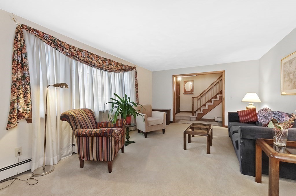 17 Nardone Road Needham, MA 02492 - Photo 6 of 22 a livingroom with workspace and a couch