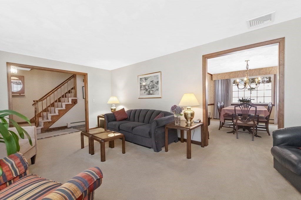 17 Nardone Road Needham, MA 02492 - Photo 7 of 22 a living room with furniture and a lamp