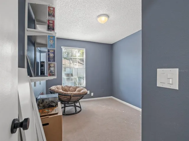 a living room with a couch and a large window