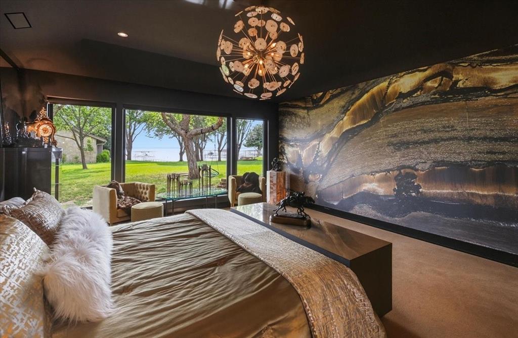 308 North Broadway Road Azle, TX 76020 - Photo 20 of 31 Primary BR w expansive windows offering serene views of the outdoors and a body of water