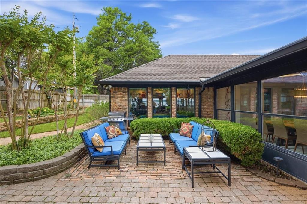 308 North Broadway Road Azle, TX 76020 - Photo 26 of 31 This property features an expansive outdoor patio area with brick pavers