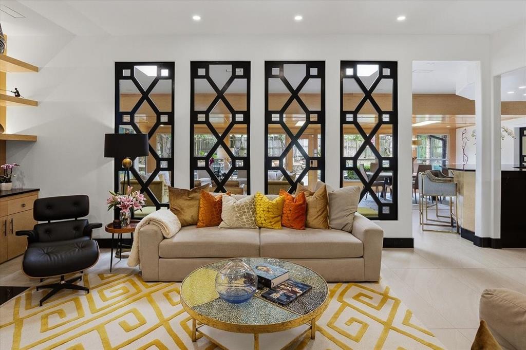 308 North Broadway Road Azle, TX 76020 - Photo 8 of 31 Living area featuring bright recessed lighting, light-toned flooring, and decorative wall mirrors
