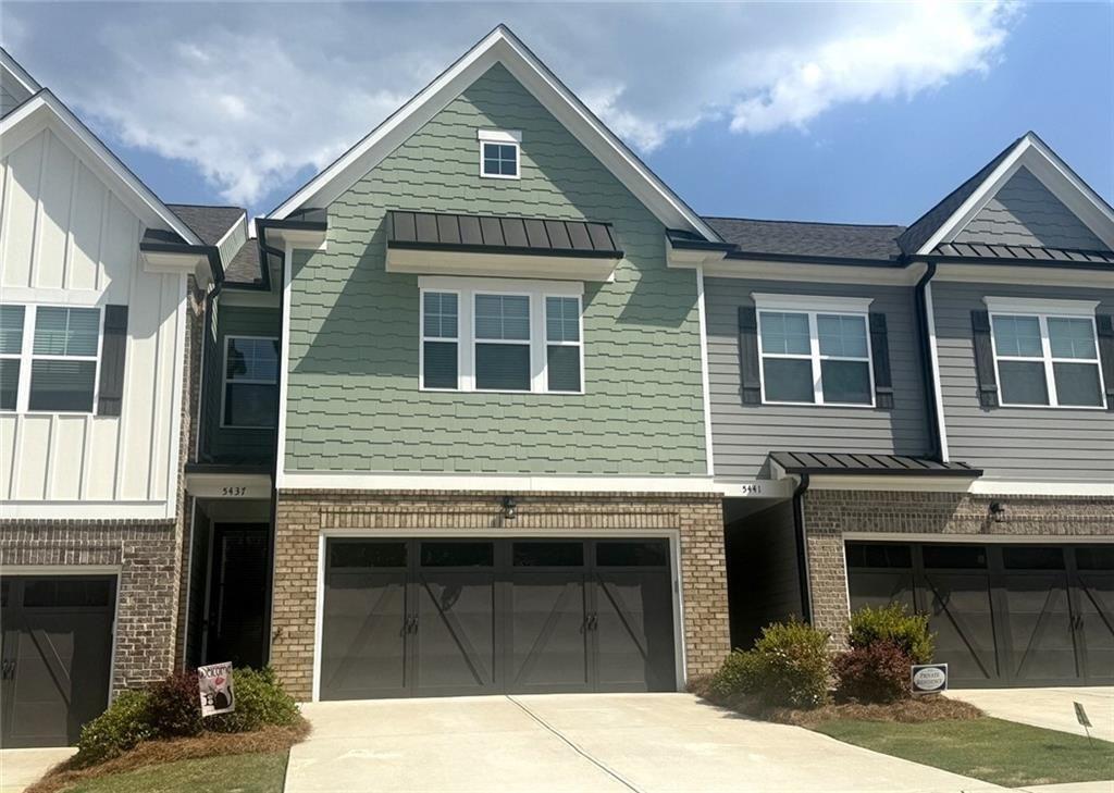 5437 Maple Grv Lane Flowery Branch, GA 30542 - Photo 1 of 27 a front view of a house with a garage