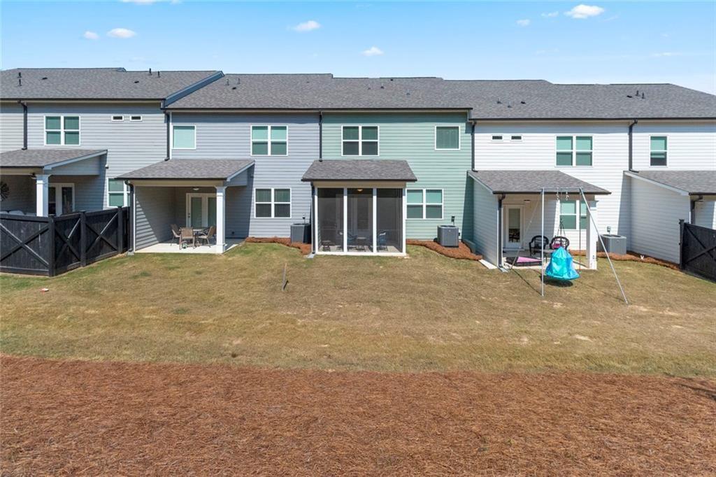 5437 Maple Grv Lane Flowery Branch, GA 30542 - Photo 14 of 27 a front view of building with yard