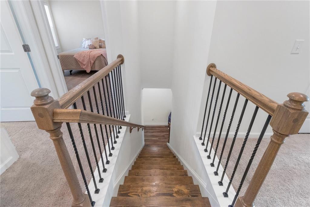 5437 Maple Grv Lane Flowery Branch, GA 30542 - Photo 16 of 27 a view of a hallway view with staircase
