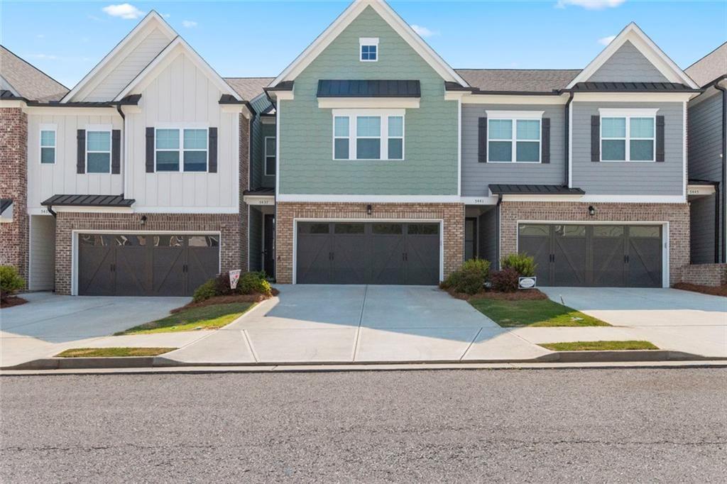 5437 Maple Grv Lane Flowery Branch, GA 30542 - Photo 2 of 27 a front view of a house with yard