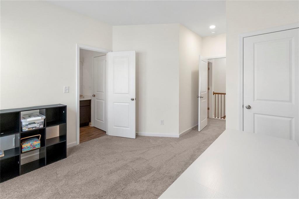 5437 Maple Grv Lane Flowery Branch, GA 30542 - Photo 22 of 27 a view of a hallway with furniture