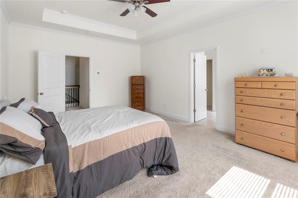 5437 Maple Grv Lane Flowery Branch, GA 30542 - Photo 24 of 27 a bedroom with a bed and a dresser