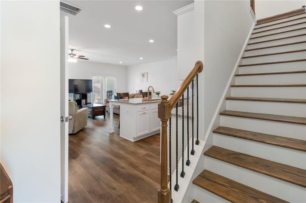 5437 Maple Grv Lane Flowery Branch, GA 30542 - Photo 4 of 27 a view of a kitchen with furniture and staircase