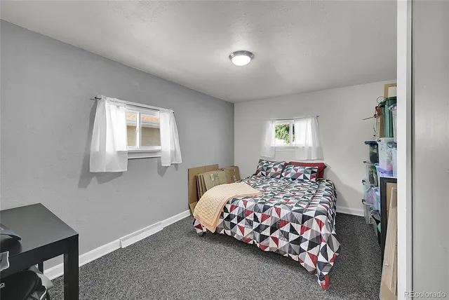 a bedroom with bed and a window