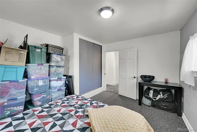 a bedroom with a bed and furniture