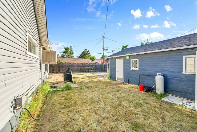 a swimming pool with yard and outdoor seating
