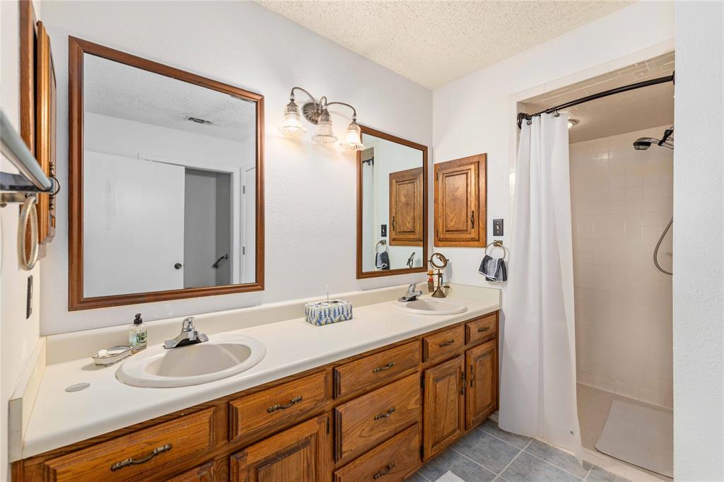 3718 Highway 36 Rising Star, TX 76471 - Photo 13 of 36 a bathroom with a double vanity sink mirror and double