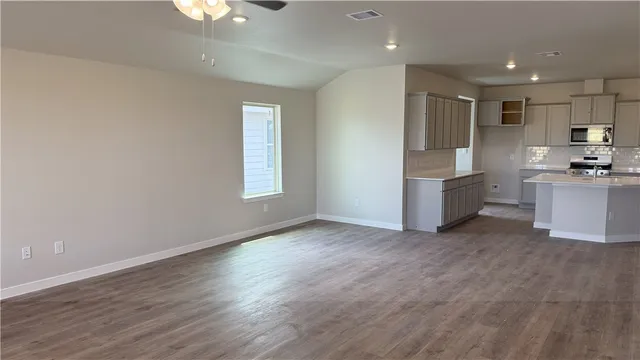 a view of kitchen with furniture and wooden floor