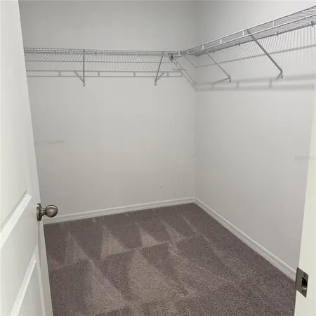 a view of a room with racks on the wall