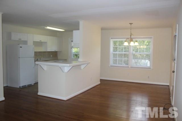 800 Friar Tuck Road Raleigh, NC 27610 - Photo 2 of 18 a view of kitchen with granite countertop window and wooden floor