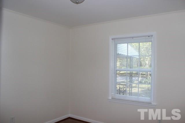 800 Friar Tuck Road Raleigh, NC 27610 - Photo 12 of 18 an empty room with a window
