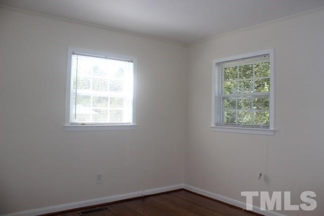 800 Friar Tuck Road Raleigh, NC 27610 - Photo 13 of 18 an empty room with a window